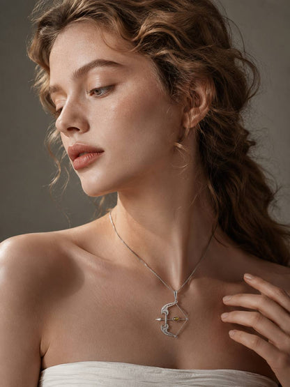 Moonshadow Archer” Vintage Silver Filigree Bow & Arrow Pendant Necklace with Mystic Stone Accent